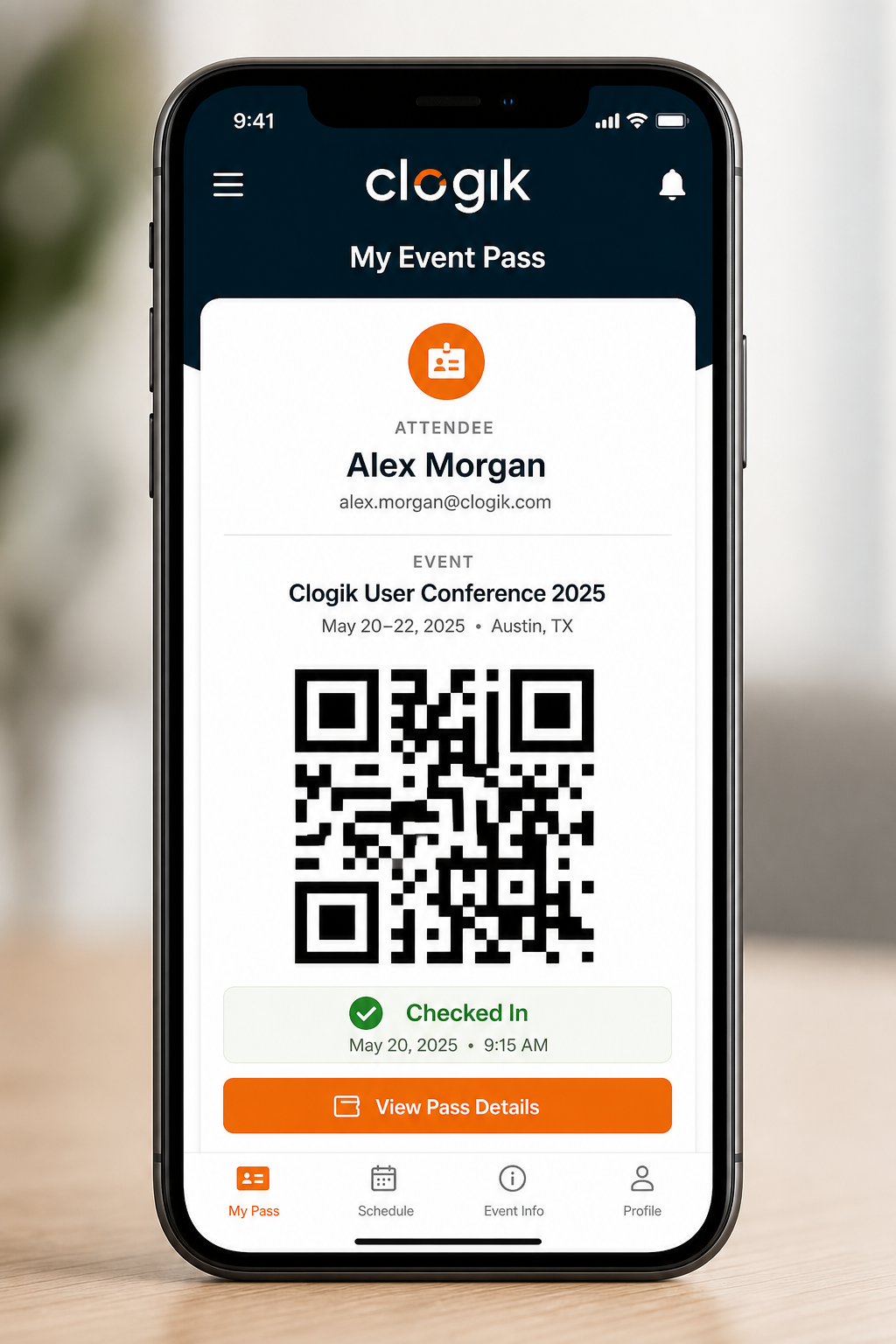 Clogik event registration mobile app showing digital QR entry pass and check-in status
